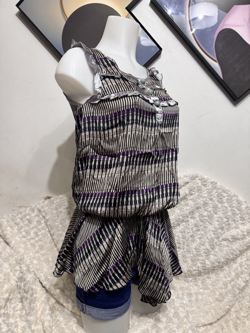 lalagirl patterned sleeveless peplum dress (Category: Dresses) located in Marikina City. Submitted by lorradel (Listing ID 1462274621, Image 2). Description: - fits S-M - Cute sleeveless peplum dress from Lalagirl. - Unique vertical stripe and purple accent pattern. - Elasticated waist for a flattering silhouette. - Ruffled trim on neckline and straps. - Versatile: looks great with shorts or leggings. - Ideal for casual outings. - MAY HAVE some w