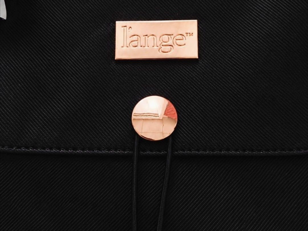 L'ange Travel Roll-Up Bag (Category: Purses & Pouches) located in Manila. Submitted by t.flavelle (Listing ID 1462427123, Image 2). Description: FOR SALE L'ange Travel Roll-Up Bag • Brand New with Tag • Heat-resistant zippered compartment ✨ • Perfect for hair tools, brushes, combs, and other beauty essentials • Compact and travel-friendly • Lightweight and easy to carry • Helps keep your styling tools organized • Elegant black design with rose go