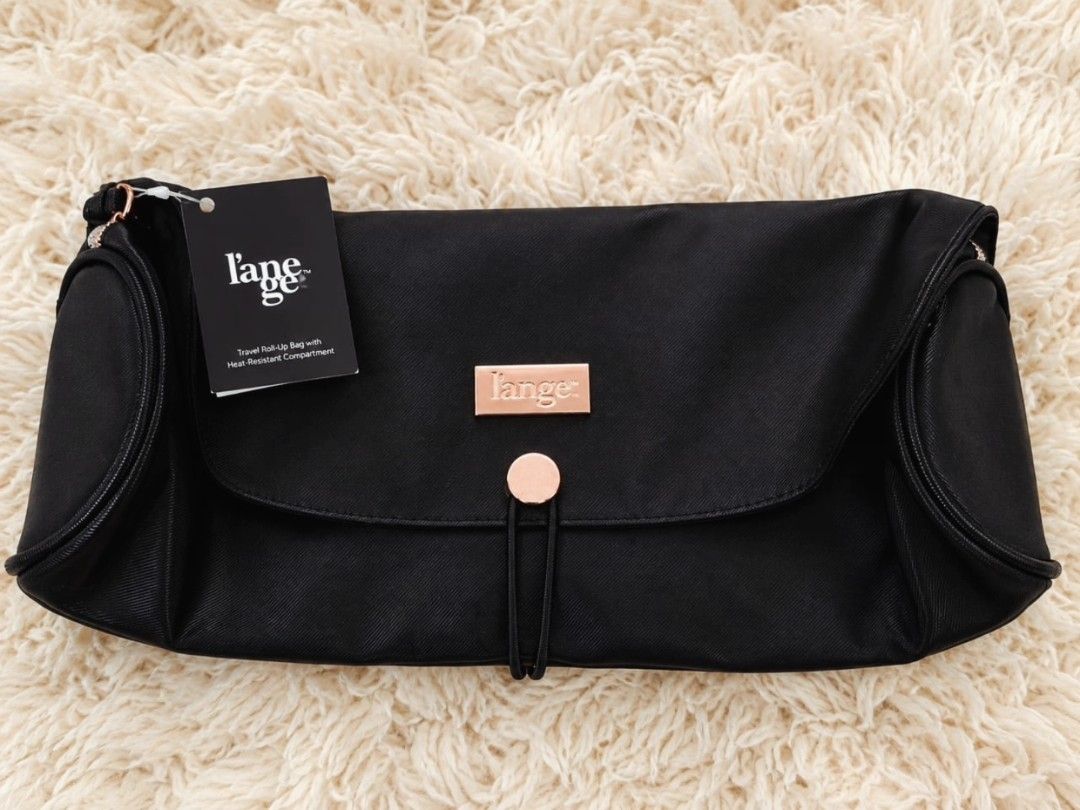 L'ange Travel Roll-Up Bag (Category: Purses & Pouches) located in Manila. Submitted by t.flavelle (Listing ID 1462427123, Image 1). Description: FOR SALE L'ange Travel Roll-Up Bag • Brand New with Tag • Heat-resistant zippered compartment ✨ • Perfect for hair tools, brushes, combs, and other beauty essentials • Compact and travel-friendly • Lightweight and easy to carry • Helps keep your styling tools organized • Elegant black design with rose go