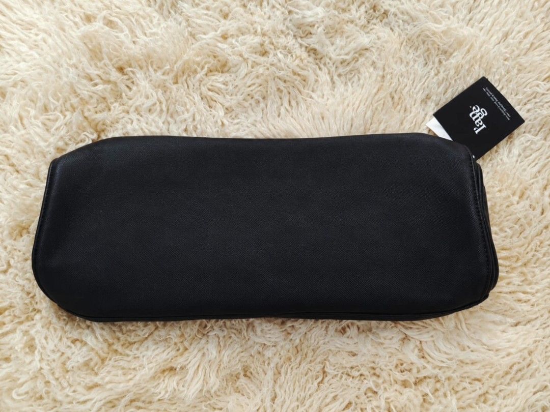 L'ange Travel Roll-Up Bag (Category: Purses & Pouches) located in Manila. Submitted by t.flavelle (Listing ID 1462427123, Image 3). Description: FOR SALE L'ange Travel Roll-Up Bag • Brand New with Tag • Heat-resistant zippered compartment ✨ • Perfect for hair tools, brushes, combs, and other beauty essentials • Compact and travel-friendly • Lightweight and easy to carry • Helps keep your styling tools organized • Elegant black design with rose go
