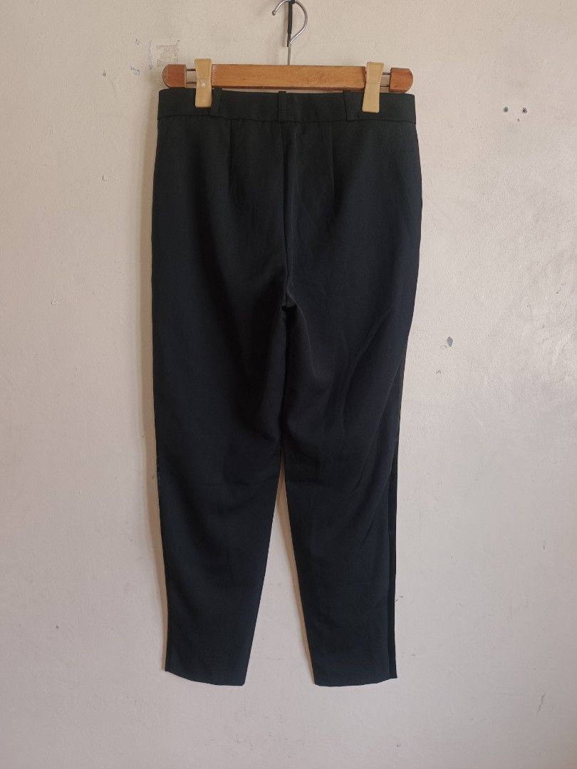 LANVIN Black Wool Blend Trousers with Satin Side Stripe (Category: Other Bottoms) located in Dasmarinas. Submitted by jessicamae43174 (Listing ID 1462281068, Image 2). Description: - Brand: Lanvin - Color: Black - Origin: Made in Poland - Material: Wool and viscose blend - Features: Satin stripe down the side of each leg - Fit: Classic, straight leg - Versatile: Great for dressing up or down - Care: Refer to label for instructions.