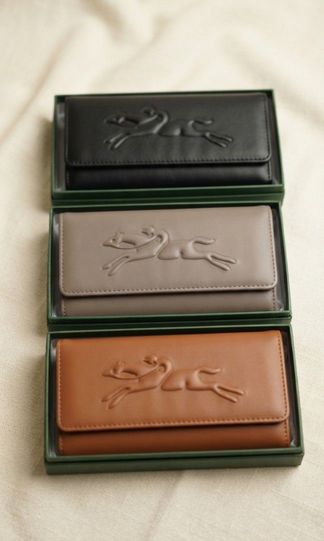 LC Long Wallet (Category: Wallets & Card holders) located in Davao. Submitted by nisa_chan04 (Listing ID 1460073799, Image 1). Description: - Long size wallet - Available colors: Black, Brown, Taupe - Kiss lock/snap button, with zipper pocket inside. - Comes with box - Ideal for organizing essentials.