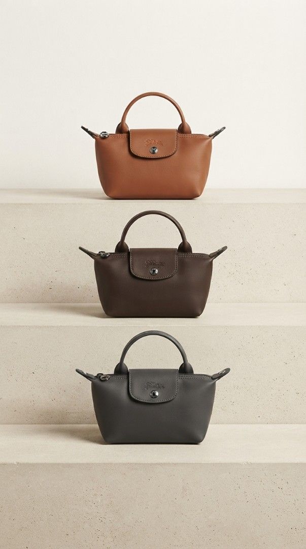 LC Top Handle Bag (Category: Luxury Bags & Wallets) located in Davao. Submitted by nisa_chan04 (Listing ID 1462372658, Image 1). Description: - Available Colors: Brown, Dark Brown, Grey - Size: Small and compact, ideal for essentials - Closure: Zipper with snap button flap for security -Comes with leather crossbody strap - Material: Genuine Leather - Perfect for everyday use SOLD per PIECE not bundle.