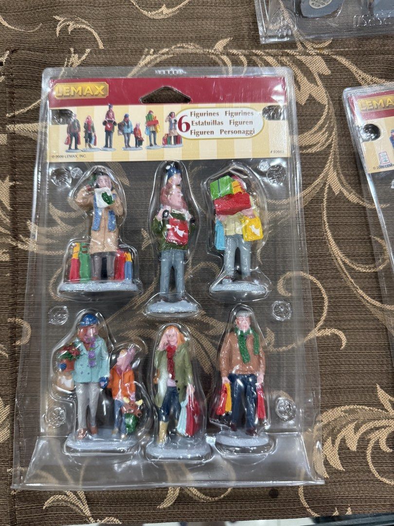 Lemax Holiday Shoppers (Category: Other Home Decor) located in Quezon City. Submitted by cheap_cheaper (Listing ID 1462390784, Image 2). Description: - Set of 6 Lemax Christmas village figurines - Depicts people out shopping with bags and gifts - Ideal for enhancing your holiday village display - Comes in original packaging.