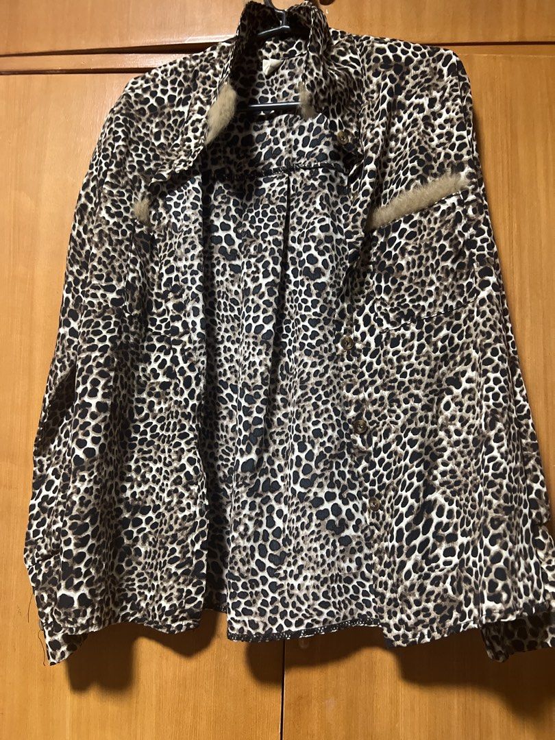 Leopard Print Button-Up Shirt with Fur Accents (Category: Shirts) located in Pasig City. Submitted by zebteashoppe01 (Listing ID 1462404805, Image 1). Description: - Trendy leopard print long-sleeve shirt - Features fuzzy fur details on pockets and collar - Classic button-up front - Perfect for making a bold fashion statement.
