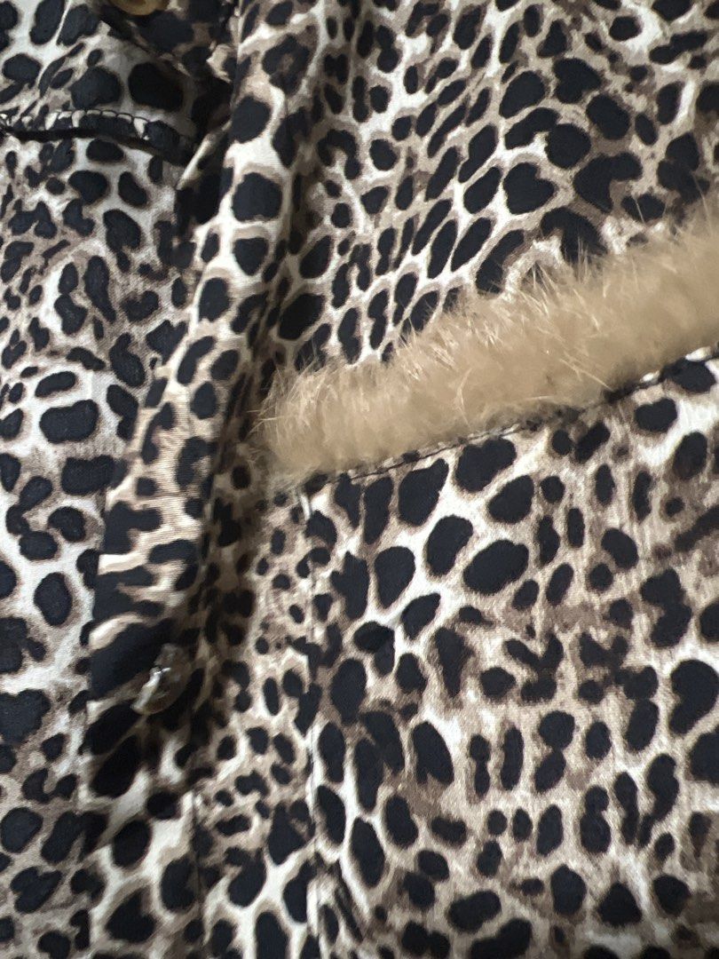 Leopard Print Button-Up Shirt with Fur Accents (Category: Shirts) located in Pasig City. Submitted by zebteashoppe01 (Listing ID 1462404805, Image 2). Description: - Trendy leopard print long-sleeve shirt - Features fuzzy fur details on pockets and collar - Classic button-up front - Perfect for making a bold fashion statement.