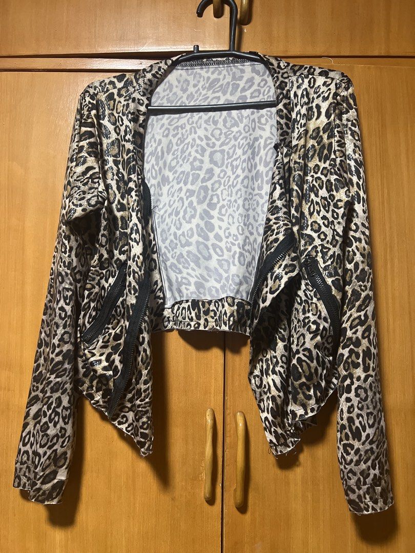 Leopard Print Cropped Jacket with Zippers (Category: Coats, Jackets and Outerwear) located in Pasig City. Submitted by zebteashoppe01 (Listing ID 1462399608, Image 1). Description: - Eye-catching leopard print cropped soft jacket styple - Trendy waterfall front design - Functional zipper details on the sides - small to medium - Ideal for evening wear or adding an edgy touch - Fabric has a subtle sheen 09096535540 Gcash mop Jnt pasig .