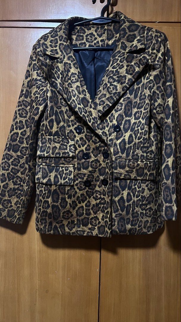 Leopard Print Double Breasted Blazer Jacket (Category: Coats, Jackets and Outerwear) located in Pasig City. Submitted by zebteashoppe01 (Listing ID 1462396664, Image 1). Description: - Eye-catching leopard print blazer - Classic double-breasted style with black buttons - Two functional front pockets - Fully lined for comfort and a polished look - Made from 100% polyester - Perfect statement piece to elevate any outfit Leopard small size but can f