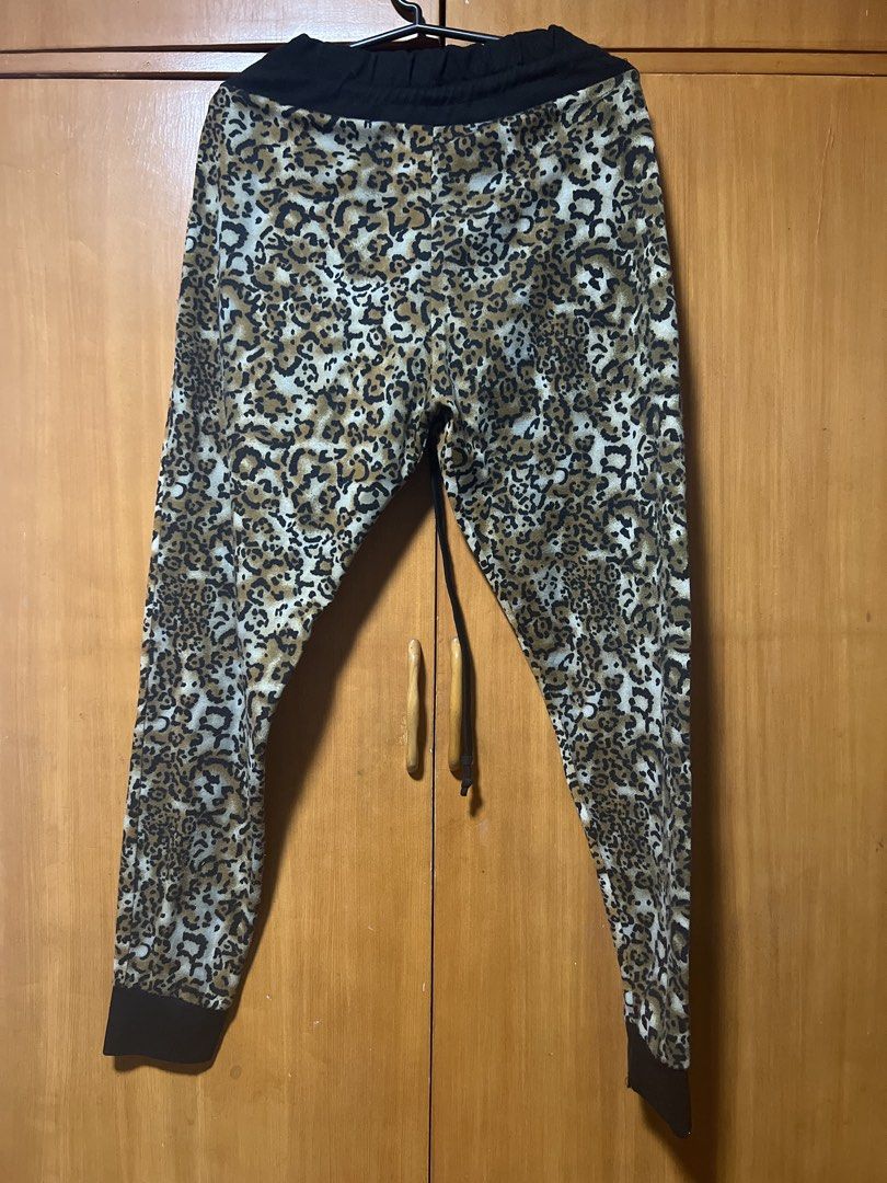 Leopard Print Jogger Pants with Drawstring Waist (Category: Other Bottoms) located in Pasig City. Submitted by zebteashoppe01 (Listing ID 1462370466, Image 2). Description: - Cool leopard print design - Comfortable black drawstring waistband - Cuffed ankles for a snug fit - Perfect for lounging or casual outings - Adds a fun, stylish touch to any outfit Small to medium jogget .