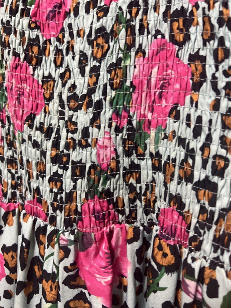 Leopard Rose Print Smocked Midi Dress (Category: Dresses) located in Pasig City. Submitted by zebteashoppe01 (Listing ID 1462405767, Image 3). Description: - Adorable midi dress with a fun leopard and rose print. - Features a comfortable smocked bodice. - Flattering flutter sleeves. - Ideal for casual outings, beach days, and everyday wear. - Easy to style and wear. Medium to large 09096535540 Gcash mop Jnt pasig .