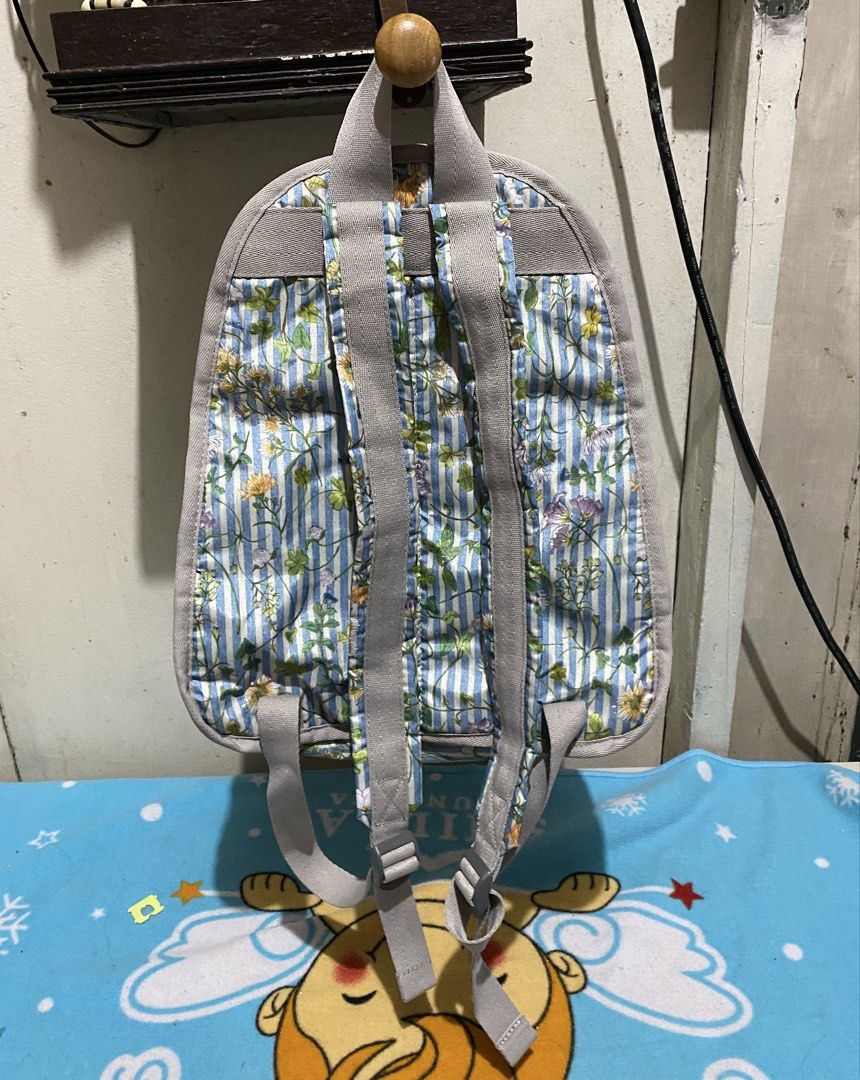 LeSportsac Floral Striped Backpack (Category: Backpacks) located in Manila. Submitted by resi.diaz (Listing ID 1462398203, Image 3). Description: - Cute LeSportsac backpack - Features a blue stripe and floral print - Includes a front zipper pocket - Adjustable straps for comfort - Ideal for everyday use or travel - Plenty of interior space - Zippers are smooth and functional - Bag is clean inside and out.