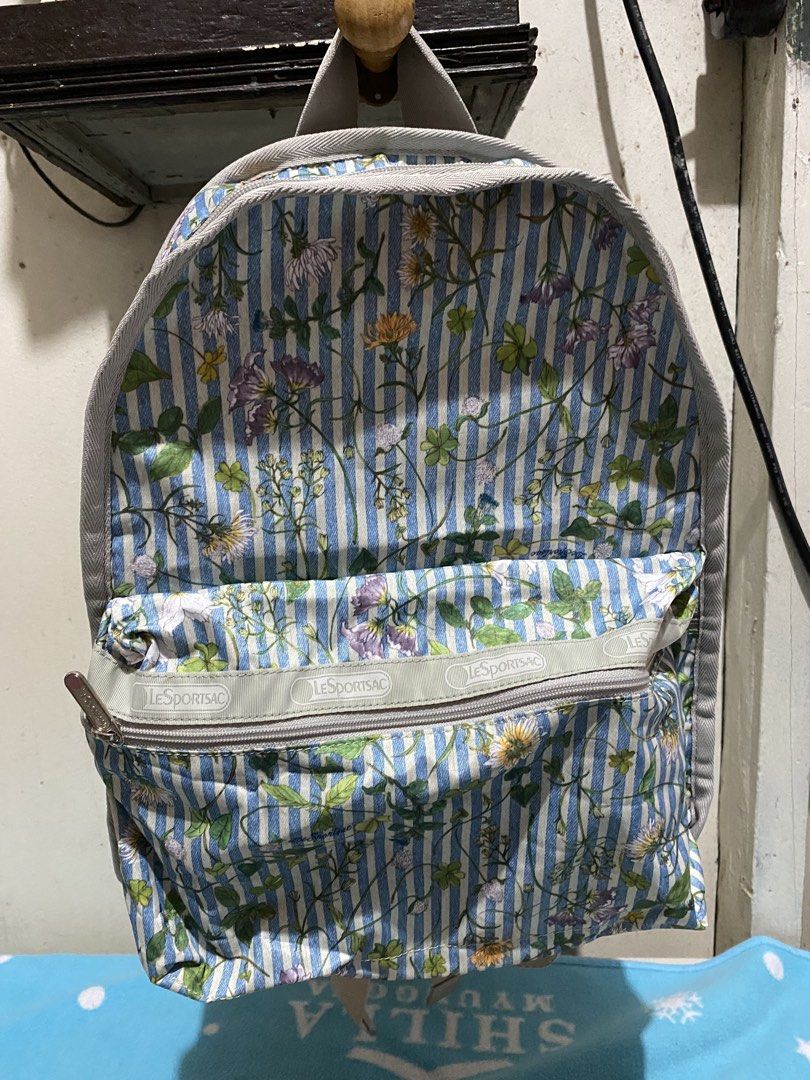 LeSportsac Floral Striped Backpack (Category: Backpacks) located in Manila. Submitted by resi.diaz (Listing ID 1462398203, Image 1). Description: - Cute LeSportsac backpack - Features a blue stripe and floral print - Includes a front zipper pocket - Adjustable straps for comfort - Ideal for everyday use or travel - Plenty of interior space - Zippers are smooth and functional - Bag is clean inside and out.