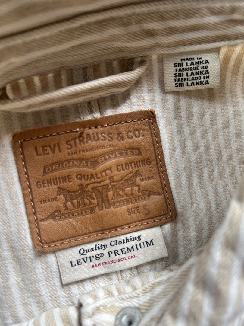 Levi's Premium Striped Worker Jacket Size S (Category: Coats, Jackets and Outerwear) located in Borongan. Submitted by thriftsbyblas (Listing ID 1462372226, Image 3). Description: - Classic Levi's worker jacket - Beige and white stripe pattern - Four front pockets - Button closure - Made with Levi's Water<Less> technology - Quality Clothing label inside - Ideal for everyday wear.