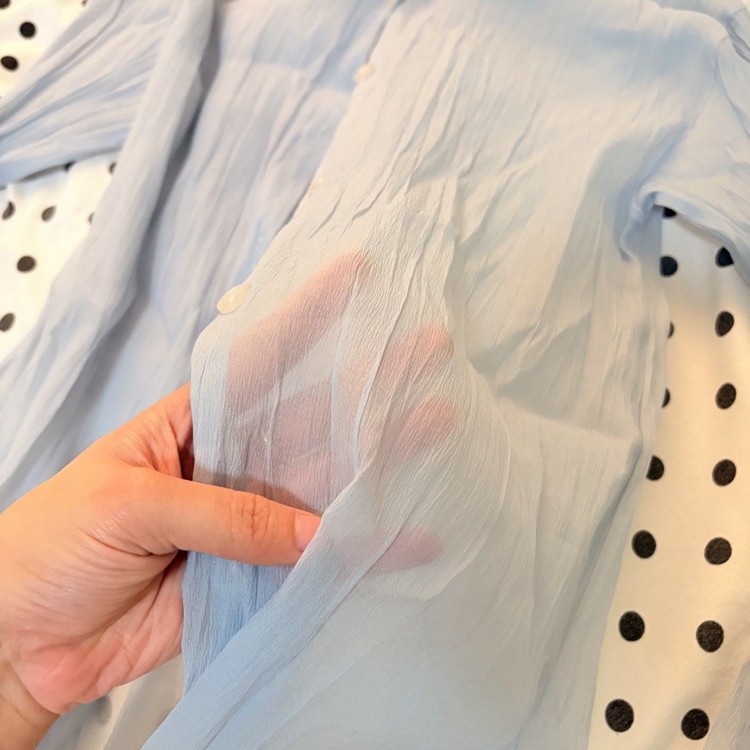 Light Blue Crinkled Long Sleeve Shirt (Category: Tshirts & Polo Shirts ) located in Pasay City. Submitted by notellyyyy (Listing ID 1462279540, Image 2). Description: - Light blue long sleeve shirt - Crinkled texture all over - Button-up front - Sheer material, ideal for layering - Size M - Versatile: pairs well with jeans or skirts.