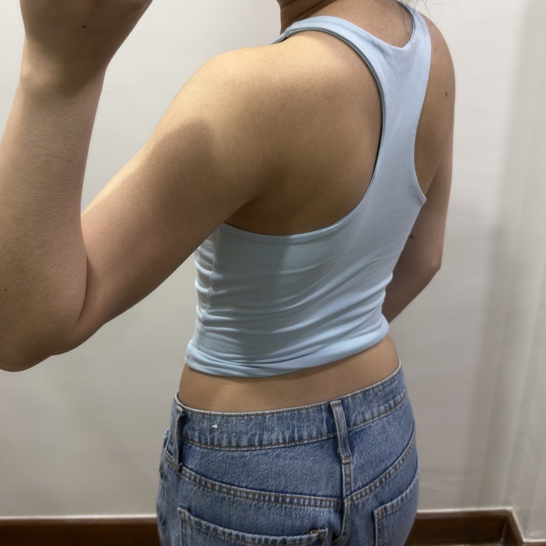 Light Blue Racerback Top (Category: Sleeveless) located in Quezon City. Submitted by miumuse_ (Listing ID 1462307506, Image 3). Description: - Light blue tank top - Flattering and stretchy fit - Perfect with high-waisted bottoms - Versatile for dressing up or down.