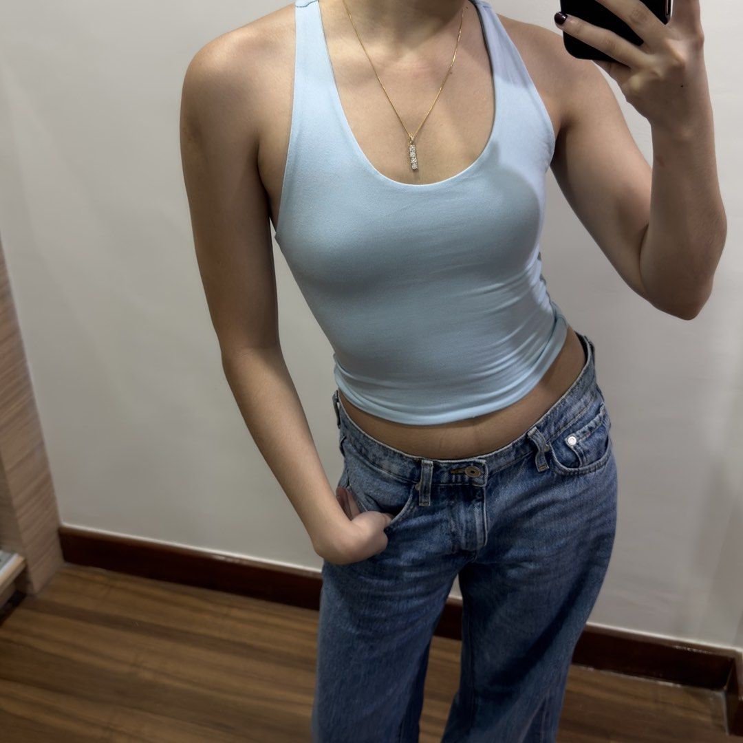 Light Blue Racerback Top (Category: Sleeveless) located in Quezon City. Submitted by miumuse_ (Listing ID 1462307506, Image 1). Description: - Light blue tank top - Flattering and stretchy fit - Perfect with high-waisted bottoms - Versatile for dressing up or down.