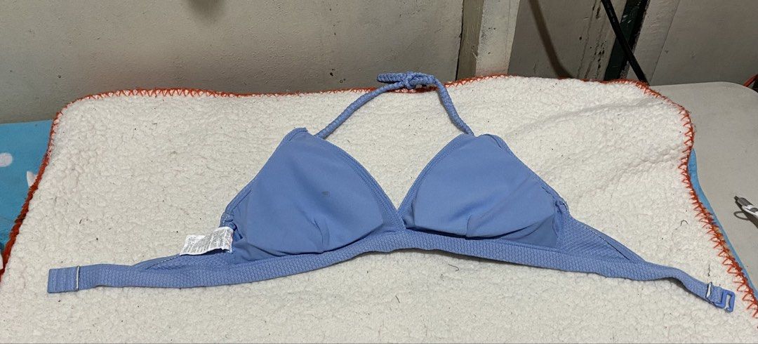 Light Blue Textured Triangle Bikini Top (Category: Bikinis & Swimsuits) located in Manila. Submitted by resi.diaz (Listing ID 1462359646, Image 2). Description: - Light blue textured bikini top - Triangle cups with tie halter neck - Adjustable strap closure at the back - Size S (BB) - Underbust measurement: 85cm - Material: Polyester and Polyurethane.