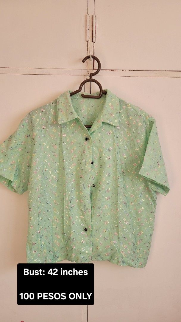 Light Green Floral Short Sleeve Button-Up Blouse (Category: Blouses) located in Bacoor. Submitted by itsmereyyy (Listing ID 1462314842, Image 1). Description: - Light green short-sleeved blouse - Delicate floral pattern - Black buttons down the front - Collared neckline - Bust: 42 inches - Ideal for casual wear or layering - Price: 100 pesos.