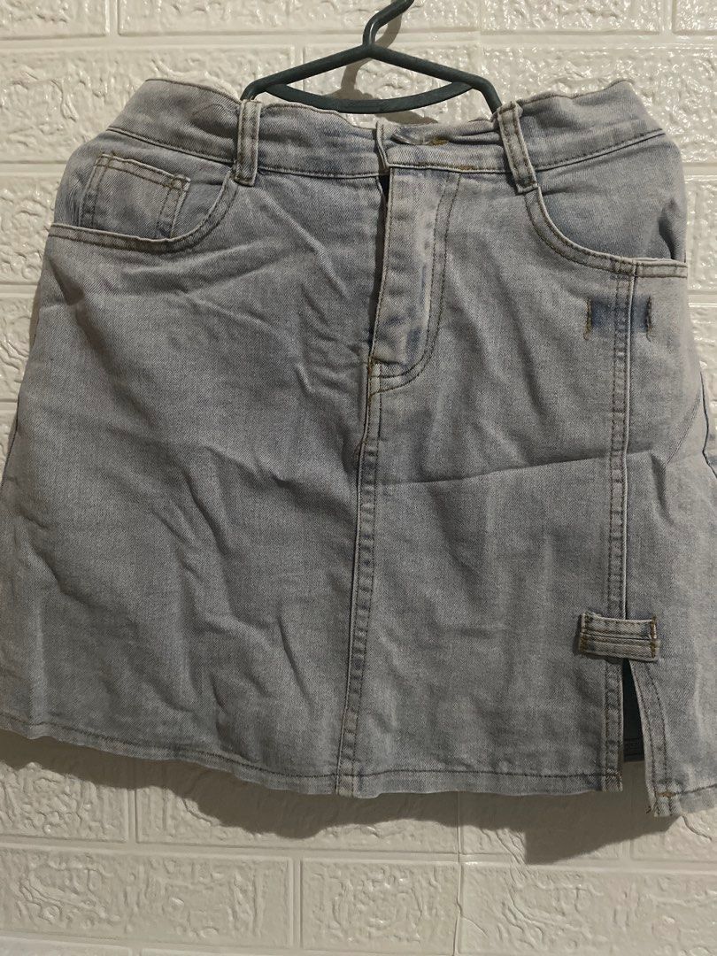 Light Wash Denim Mini Skirt with Side Slit (Category: Skirts) located in Manila. Submitted by myshanshine (Listing ID 1462373368, Image 1). Description: - Cute light wash denim mini skirt - Features a side slit with button detail - Ideal for casual outings and summer vibes - Easy to pair with any top - can fit S-SL.