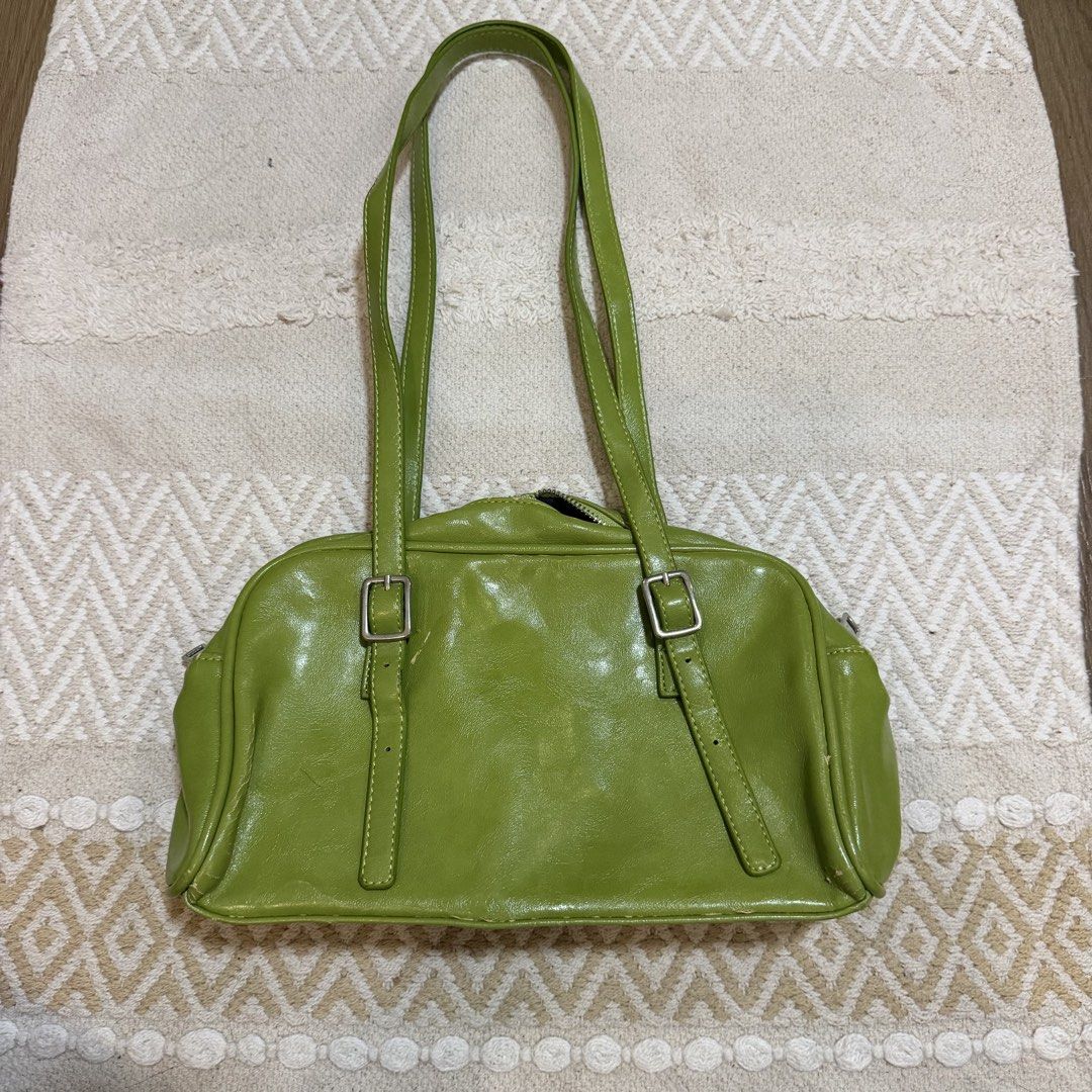 Lime Green Shoulder Bag (Category: Shoulder Bags) located in Batangas. Submitted by prelove.kk (Listing ID 1462401990, Image 1). Description: - Cute lime green shoulder bag - Two main compartments with zipper closure - Adjustable buckle straps - Plenty of life left, great for everyday use.