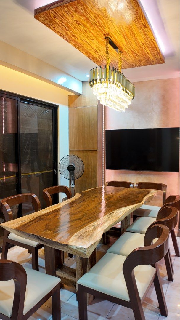 Live Edge 8-Seater Solid Acacia Dining Table (Category: Tables & Sets) located in Mandaluyong City. Submitted by guiltyshoppaholic (Listing ID 1462317713, Image 1). Description: Selling our beautiful 8-seater solid Acacia live-edge slab dining table with 8 matching chairs. A substantial statement piece featuring a naturally shaped live edge, rich wood grain, and glossy finish. Table Dimensions: 197 cm Length × 92 cm Width × 76 cm Height Includes 