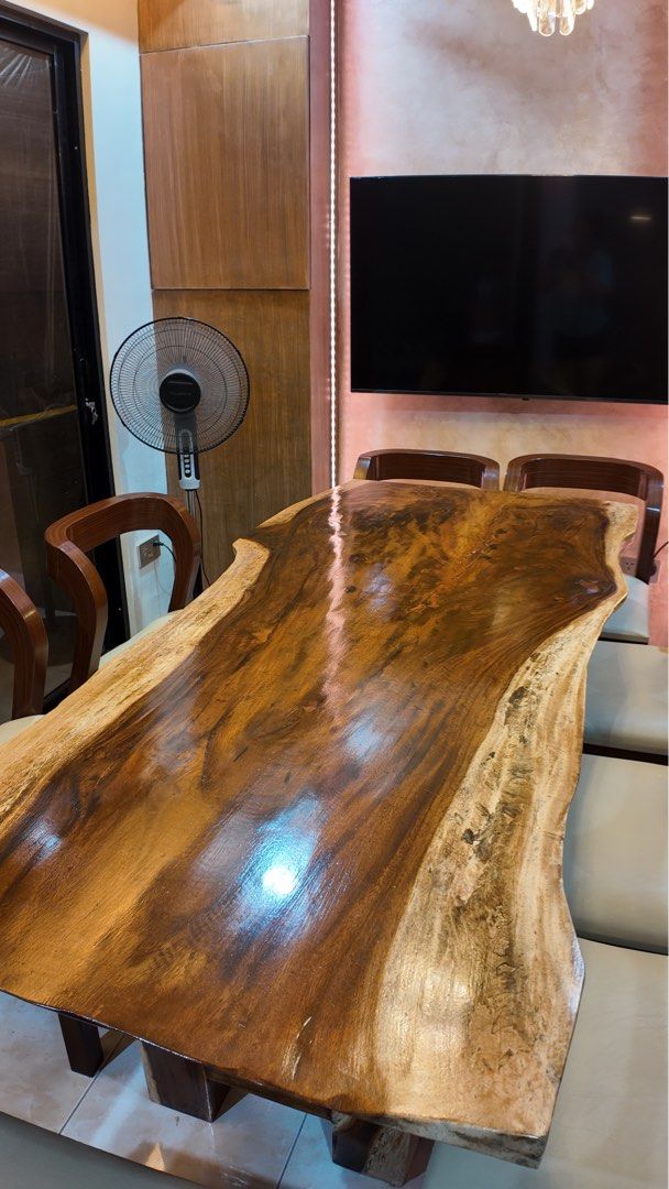 Live Edge 8-Seater Solid Acacia Dining Table (Category: Tables & Sets) located in Mandaluyong City. Submitted by guiltyshoppaholic (Listing ID 1462317713, Image 3). Description: Selling our beautiful 8-seater solid Acacia live-edge slab dining table with 8 matching chairs. A substantial statement piece featuring a naturally shaped live edge, rich wood grain, and glossy finish. Table Dimensions: 197 cm Length × 92 cm Width × 76 cm Height Includes 