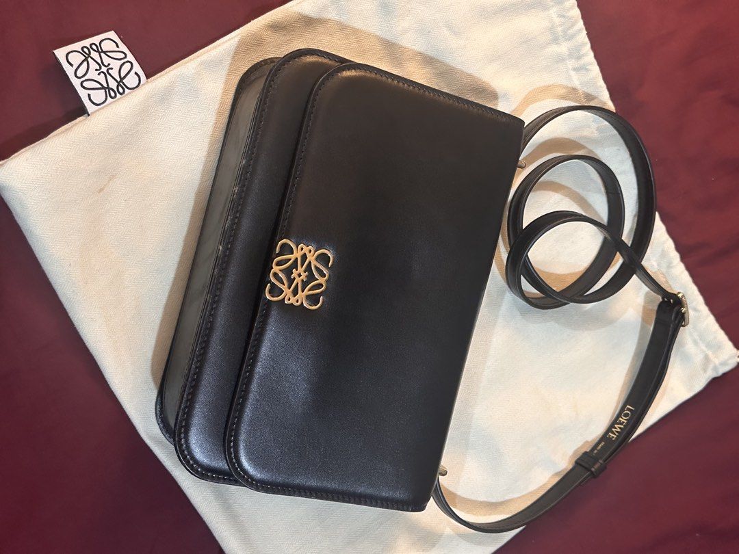 Loewe Black Leather Shoulder Bag with Gold Anagram (Category: Luxury Bags & Wallets) located in Mandaluyong City. Submitted by tonsaribay58244 (Listing ID 1462431237, Image 1). Description: - Loewe black leather shoulder bag - Iconic gold anagram clasp - Interior zip pocket and card slots - Made in Spain - Comes with dust bag - Perfect for daily use or special events.