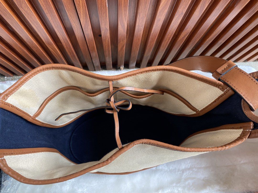 Loewe Paulas Ibiza (Category: Luxury Bags & Wallets) located in Cavite. Submitted by wildowl-0f14 (Listing ID 1462319081, Image 2). Description: ‼️SALE‼️SALE‼️ • Brand: LOEWE • Material: Calfskin/Canvas • Made in Spain SPAIN • Dimensions: Approx. 31cm (L) x 33cm (H) x 13cm (W) | Shoulder strap length approx . 61cm • Inner Layer Format: Open opening; 2 inner patch pockets Payment via gcash/banktransfer No rush shipping.