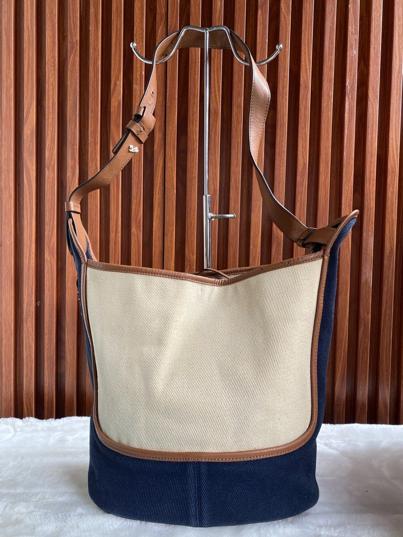 Loewe Paulas Ibiza (Category: Luxury Bags & Wallets) located in Cavite. Submitted by wildowl-0f14 (Listing ID 1462319081, Image 1). Description: ‼️SALE‼️SALE‼️ • Brand: LOEWE • Material: Calfskin/Canvas • Made in Spain SPAIN • Dimensions: Approx. 31cm (L) x 33cm (H) x 13cm (W) | Shoulder strap length approx . 61cm • Inner Layer Format: Open opening; 2 inner patch pockets Payment via gcash/banktransfer No rush shipping.