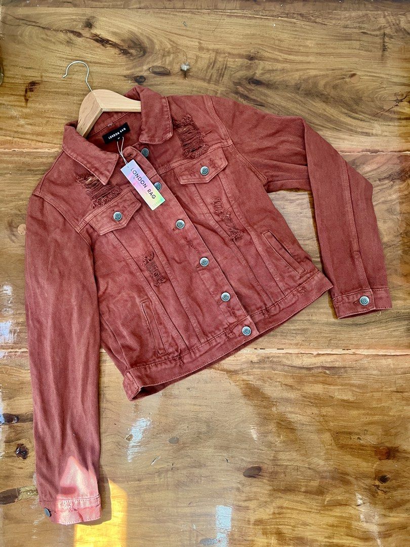 LONDON RAG Distressed Orange/Rust Denim Jacket Size M (Category: Coats, Jackets and Outerwear) located in Rosario. Submitted by chasiebananie (Listing ID 1462294421, Image 1). Description: Distressed denim jacket from London Rag Orange/Rust color Size Medium Distressed look with rips on the front and back. Button closure Functional pockets Great for layering Personally owned, never used. Tag still intact.