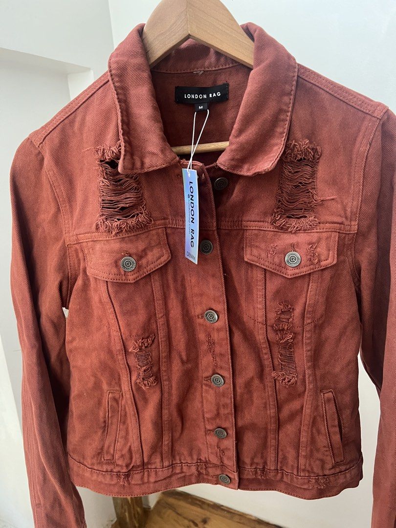 LONDON RAG Distressed Orange/Rust Denim Jacket Size M (Category: Coats, Jackets and Outerwear) located in Rosario. Submitted by chasiebananie (Listing ID 1462294421, Image 3). Description: Distressed denim jacket from London Rag Orange/Rust color Size Medium Distressed look with rips on the front and back. Button closure Functional pockets Great for layering Personally owned, never used. Tag still intact.