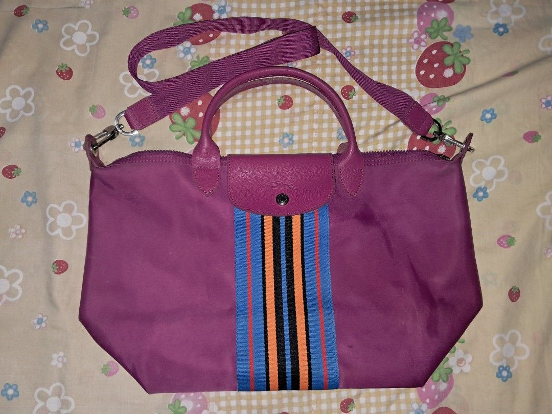 Longchamp Le Pliage Shoulder Bag Purple Striped (Category: Luxury Bags & Wallets) located in Manila. Submitted by terabentables2 (Listing ID 1462431141, Image 1). Description: LONGCHAMP SHOULDER BAG DETAILS ⋆｡𖦹°‧★ ── ₱300 ⋆ Purple Longchamp Le Pliage Bag ⋆ Eye-catching stripe detail on the front ⋆ Vibrant bright pink interior with a convenient small pocket ⋆ Secure zip-top closure ⋆ Ideal size for everyday school use ₊✩‧₊˚౨ৎ˚₊✩‧₊ MOP: GCASH MOD: