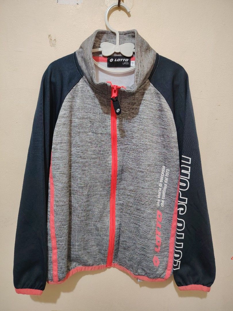 Lotto Life's Kids Track Jacket Size 130 (Category: Babies & Kids Fashion) located in Manila. Submitted by forthriftstorewarriors (Listing ID 1462319085, Image 1). Description: - Lotto Life's track jacket - Color: Grey and dark blue - Accents: Bright pink zipper and details - Sleeve detail: 'Lotto Sport' text - Size: 130 (7-8Y) - Ideal for active kids.