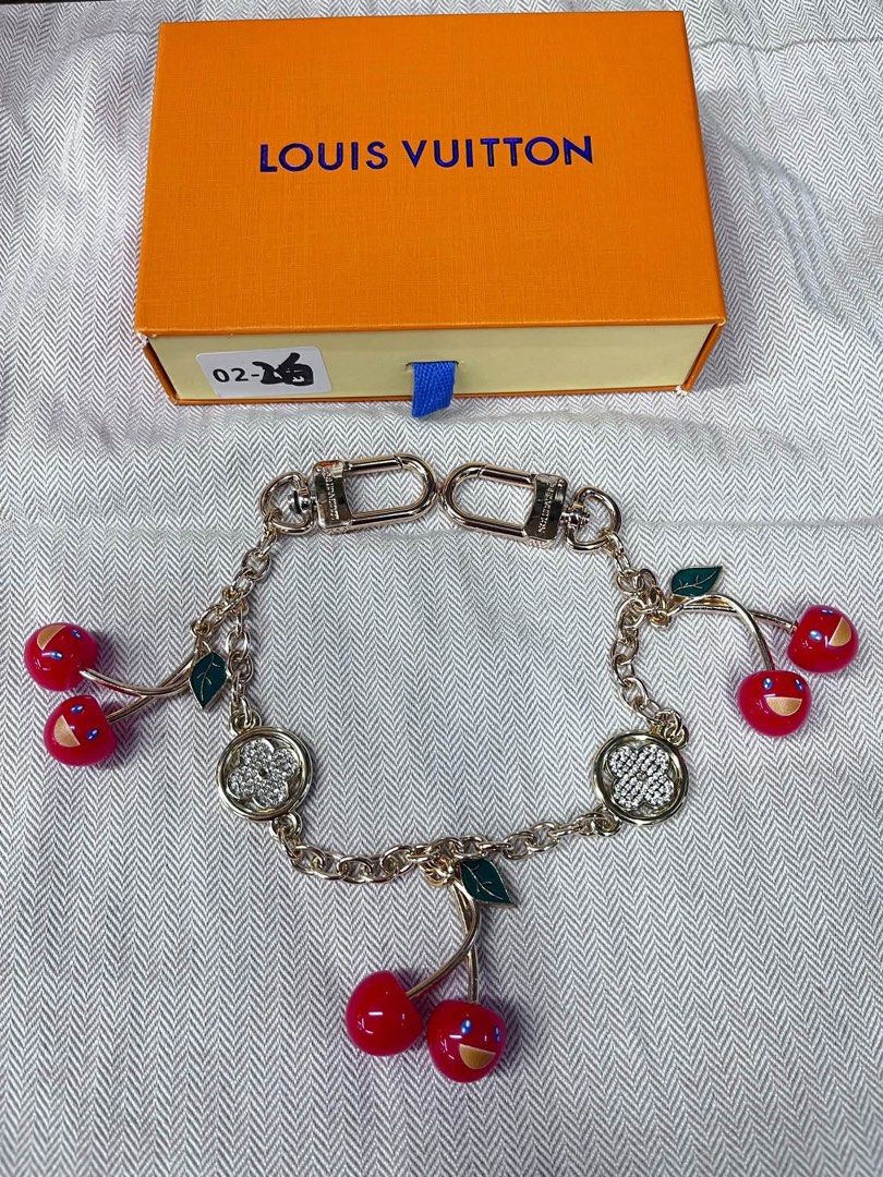Louis Vuitton Cherry Bag Charm with Box #2 (Category: Community) located in Angeles City. Submitted by migs_font29 (Listing ID 1462366498, Image 1). Description: - Authentic Louis Vuitton bag charm - Features cute cherry charms with smiley faces - Adorned with crystal flower details - Comes with original Louis Vuitton box - Adds a playful touch to bags or can be used as a keychain.