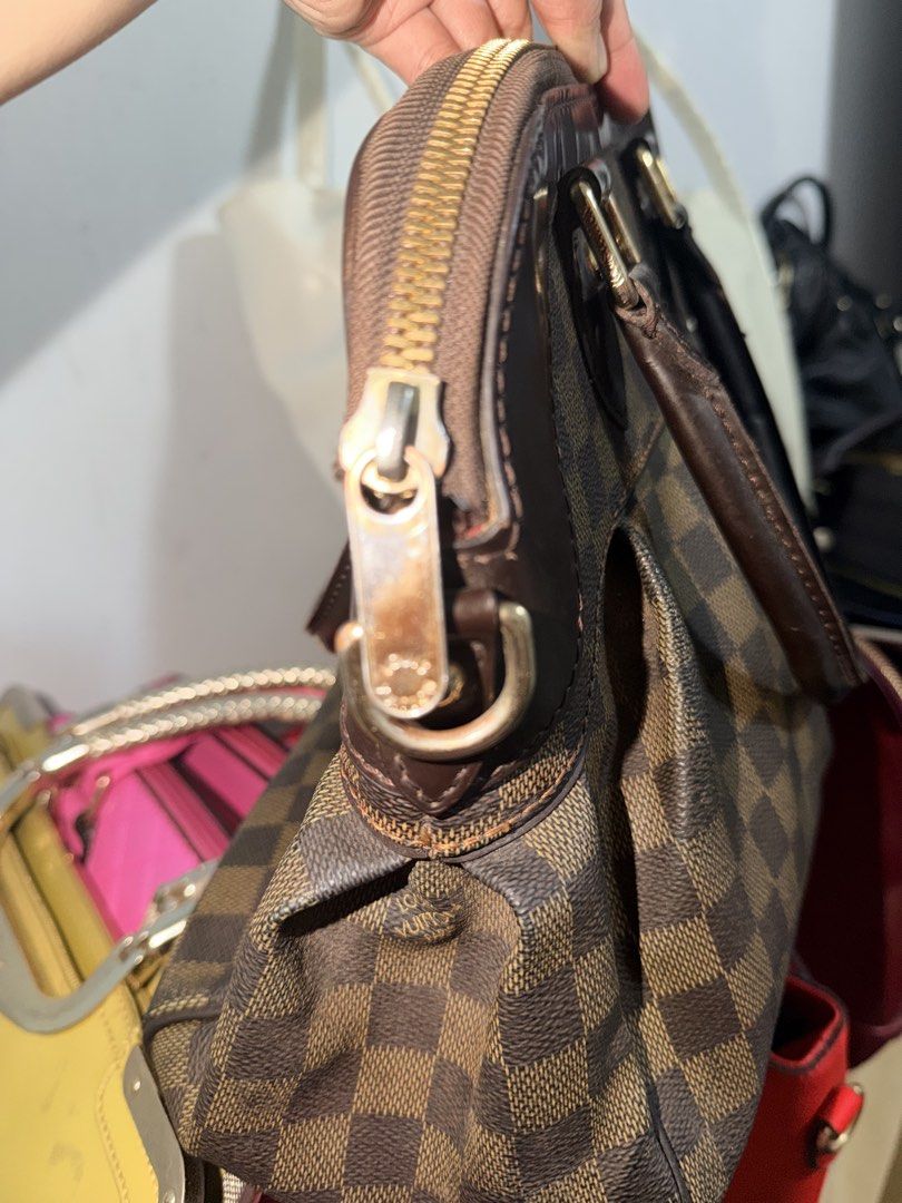Louis Vuitton Damier Ebene Speedy 30 Handbag (Category: Luxury Bags & Wallets) located in Manila. Submitted by lhynbagscollection (Listing ID 1462415839, Image 3). Description: - Authentic Louis Vuitton Speedy 30 - Damier Ebene canvas - Classic design with comfortable top handles - Secure zipper closure - Interior pockets for organization - Minor signs of wear on zipper pull and leather trim.