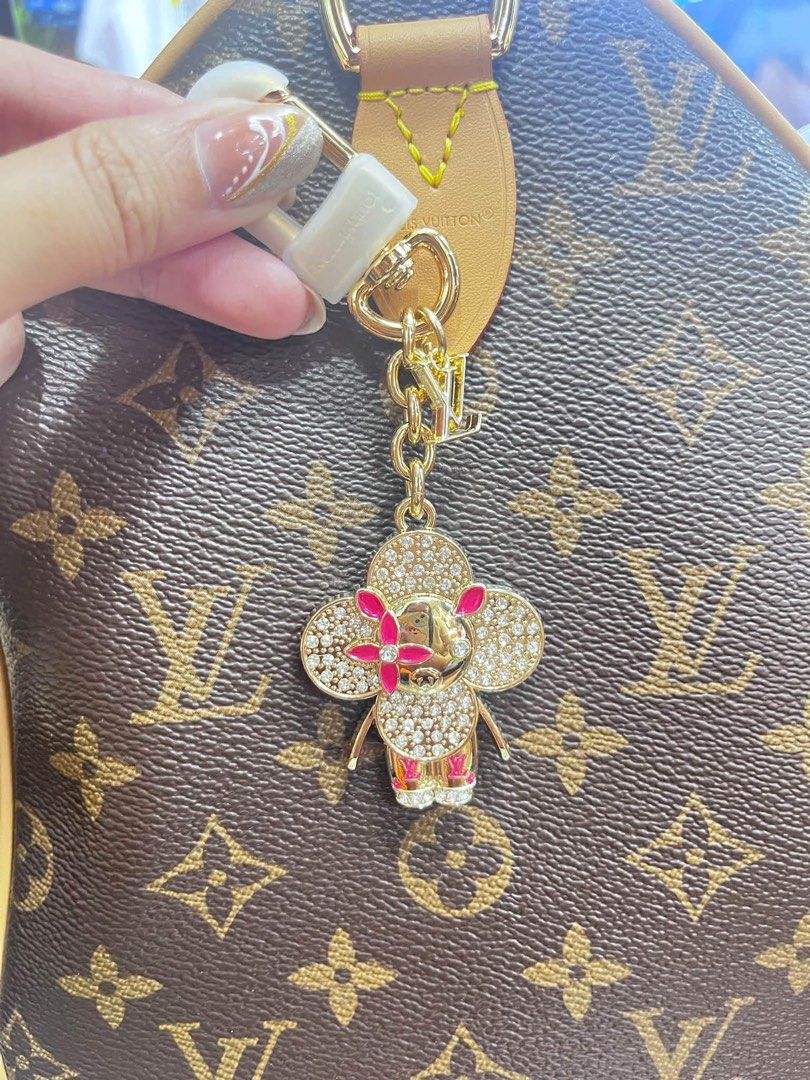 Louis Vuitton Monogram Bag Charm with Lock (Category: Voice Recorders) located in Angeles City. Submitted by migs_font29 (Listing ID 1462365906, Image 1). Description: - Authentic Louis Vuitton bag charm - Iconic monogram canvas pattern - Features a cute character design with rhinestones and pink accents - Includes a small lock and key - Gold-tone hardware - Secure clasp for attaching to bags.