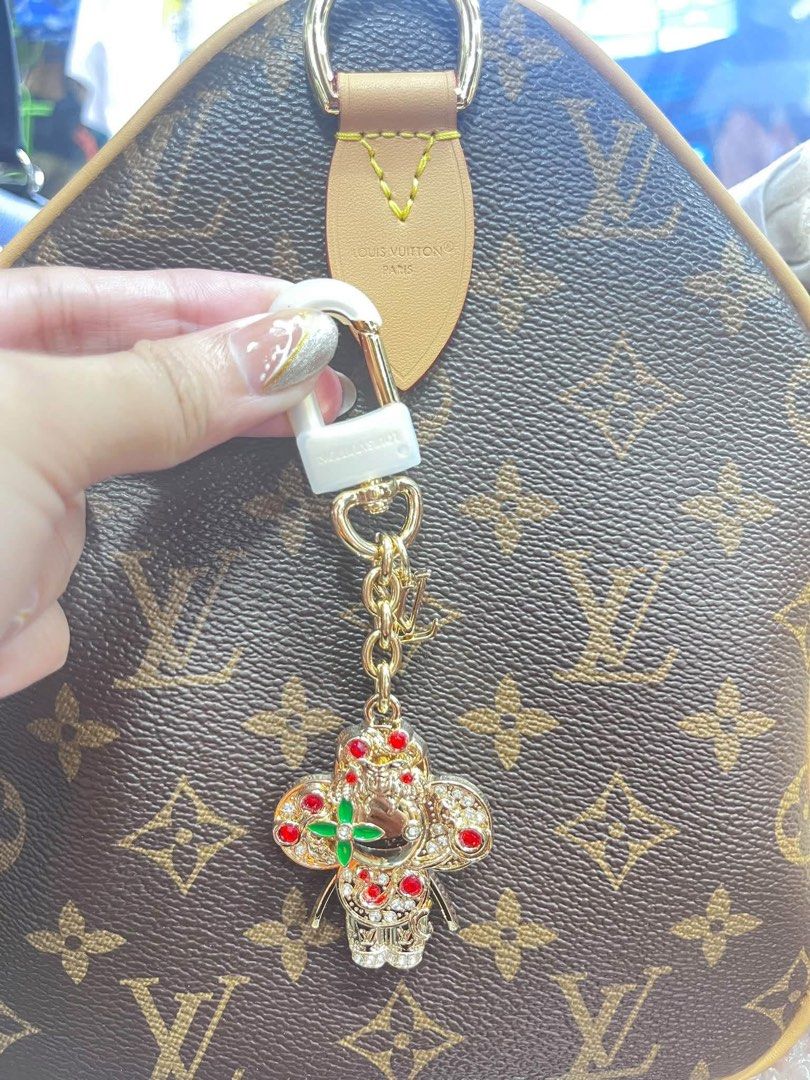 Louis Vuitton Monogram Bag Charm with Lock (Category: Community) located in Angeles City. Submitted by migs_font29 (Listing ID 1462365960, Image 1). Description: - Authentic Louis Vuitton bag charm - Features iconic monogram canvas - Detailed, jeweled design - Includes a white lock and gold chain - Comes with original lock and key - Adds a unique touch to any LV bag.