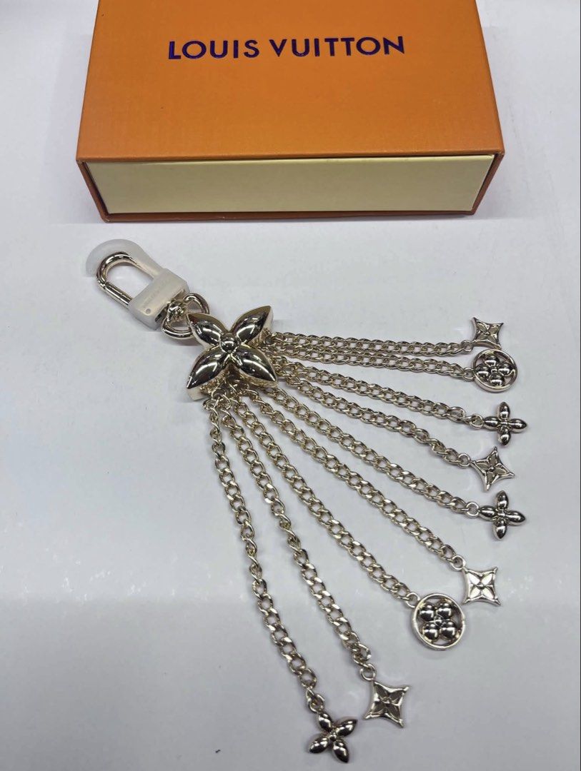 Louis Vuitton Monogram Flower Chain Charm (Category: Community) located in Angeles City. Submitted by migs_font29 (Listing ID 1462365838, Image 1). Description: - Authentic Louis Vuitton charm - Features multiple LV monogram flower charms - Delicate silver chains - Secure clasp attachment - Comes with original Louis Vuitton box - Perfect for bags or keys.