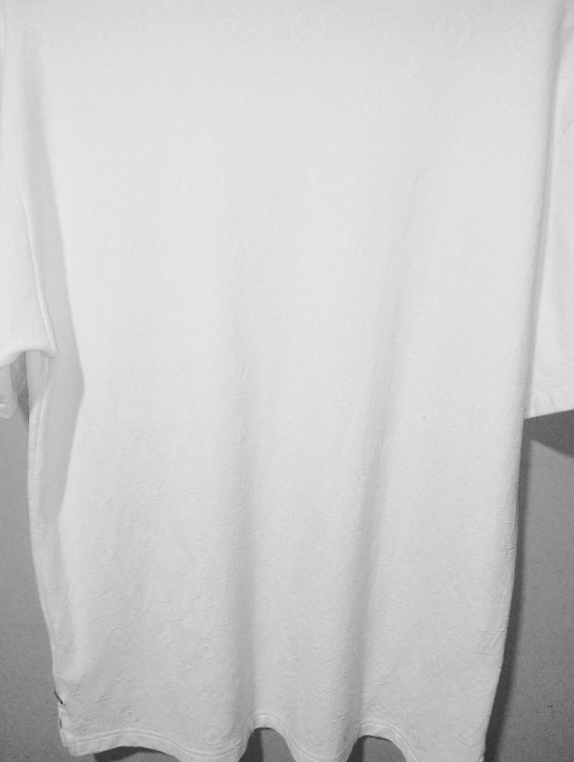 Louis Vuitton Monogram T-shirt White (Category: Tshirts & Polo Shirts ) located in Caloocan City. Submitted by yazzielux (Listing ID 1462431768, Image 2). Description: - Authentic Louis Vuitton t-shirt - Classic white color - All-over LV monogram pattern - Features a chest pocket - Crew neck, short sleeves - Versatile staple piece for any wardrobe - Pairs well with jeans or shorts.