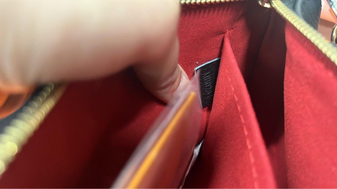 Louis Vuitton Pouch Bag Black Monogram (Category: Voice Recorders) located in Angeles City. Submitted by migs_font29 (Listing ID 1462350831, Image 2). Description: - Authentic Louis Vuitton Monogram Pouch Bag - Classic LV monogram print - Vibrant red interior lining - Secure zipper closure - Comes with detachable chain strap - Includes detachable leather strap - Authenticity code visible inside - Versatile: great for everyday use or as a clutch.
