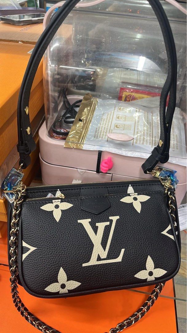 Louis Vuitton Pouch Bag Black Monogram (Category: Voice Recorders) located in Angeles City. Submitted by migs_font29 (Listing ID 1462350831, Image 1). Description: - Authentic Louis Vuitton Monogram Pouch Bag - Classic LV monogram print - Vibrant red interior lining - Secure zipper closure - Comes with detachable chain strap - Includes detachable leather strap - Authenticity code visible inside - Versatile: great for everyday use or as a clutch.