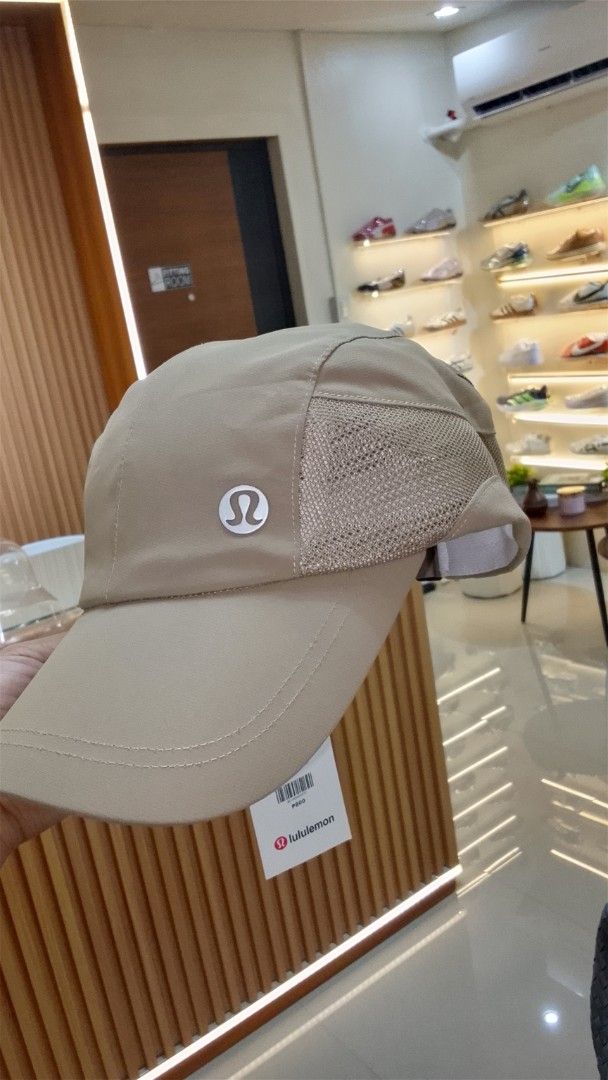 Lululemon Cap - Beige (Category: Caps & Hats) located in Bulacan. Submitted by imrolene (Listing ID 1462310330, Image 2). Description: - Brand new Lululemon cap - Stylish beige color - Breathable mesh side panels - Features Lululemon logo on the front - Comes with original tags attached - Ideal for everyday wear and workouts.