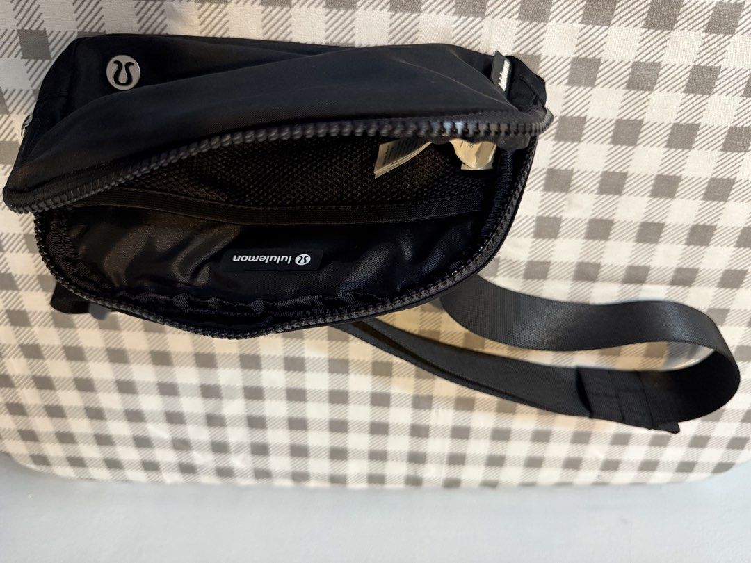 Lululemon Everywhere Belt Bag Black (Category: Cross-body Bags) located in Manila. Submitted by sarj09732 (Listing ID 1462419810, Image 3). Description: - Classic black Lululemon belt bag - Water-resistant fabric - Main zippered compartment - Interior mesh pocket - Adjustable strap for crossbody or waist wear - Ideal for everyday essentials - Easy to clean.