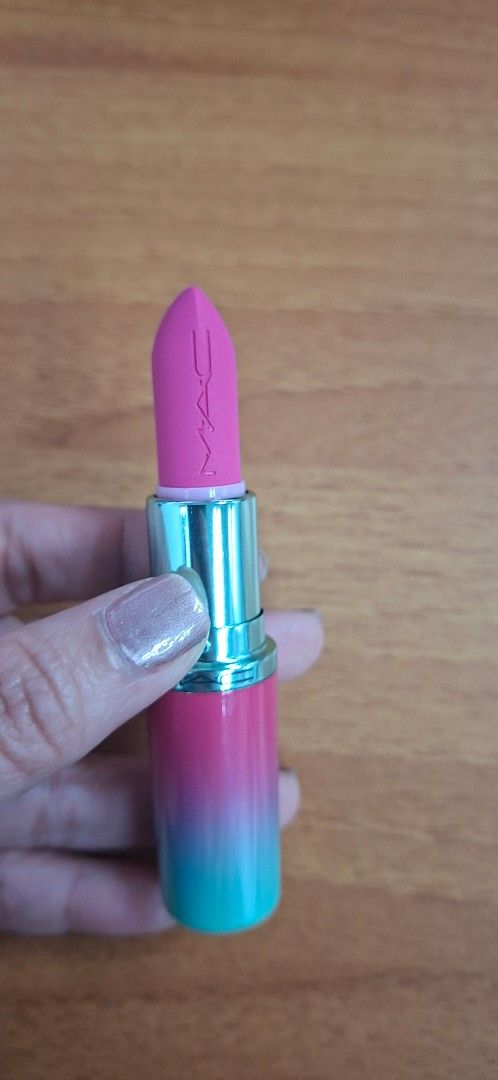 MAC Lipstick Candy Yum-Yum Matte (Category: Makeup) located in Taguig. Submitted by lizzvalen (Listing ID 1462330742, Image 2). Description: - MAC Lipstick in Candy Yum-Yum - Matte finish - Features a stylish pink and teal ombre packaging - MAC logo embossed on the lipstick bullet - Lightly used, with plenty of product remaining.