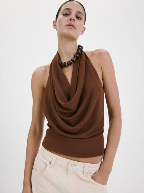 Mango Brown Drape Cowl Neck Backless Top (Category: Sleeveless) located in Quezon City. Submitted by 00bdavis (Listing ID 1462320927, Image 1). Description: bought here on carousell for 1k. tried on once. rfs: does not fit me mop: gcash, bpi delivery: grab/lalamove (c/o buyer) location: katipunan, qc.