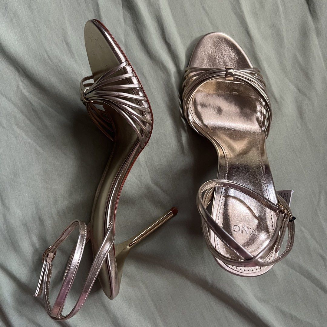 mango gold heeled sandals with straps (Category: Flats & Sandals) located in Imus. Submitted by an4kin (Listing ID 1462304603, Image 3). Description: 🗒️ condition: brand new, just tried on once. 🗒️ packaging: comes with a replacement box (threw the original away but i have a pic of it) 🗒️ srp: ₱2,300+ 🥢 rfs: the heel is just a bit too high for my personal comfort level. .