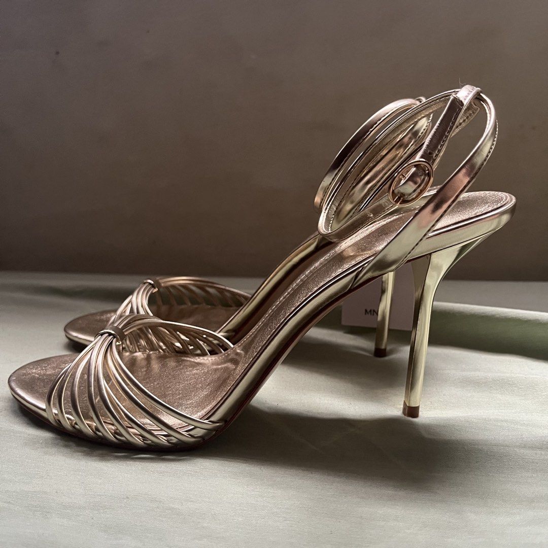 mango gold heeled sandals with straps (Category: Flats & Sandals) located in Imus. Submitted by an4kin (Listing ID 1462304603, Image 1). Description: 🗒️ condition: brand new, just tried on once. 🗒️ packaging: comes with a replacement box (threw the original away but i have a pic of it) 🗒️ srp: ₱2,300+ 🥢 rfs: the heel is just a bit too high for my personal comfort level. .