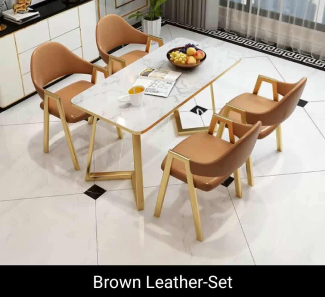 Marble Top Dining Table with 4 Chairs (Various Colors) (Category: Tables & Sets) located in Mandaluyong City. Submitted by carmy.94 (Listing ID 1462433040, Image 3). Description: - Modern dining set - Marble-look tabletop - Gold legs - Includes 4 comfortable chairs - Available in grey, white, brown, green, or black leather upholstery - Ideal for small to medium dining spaces - Easy to clean surface - Sleek chair design.