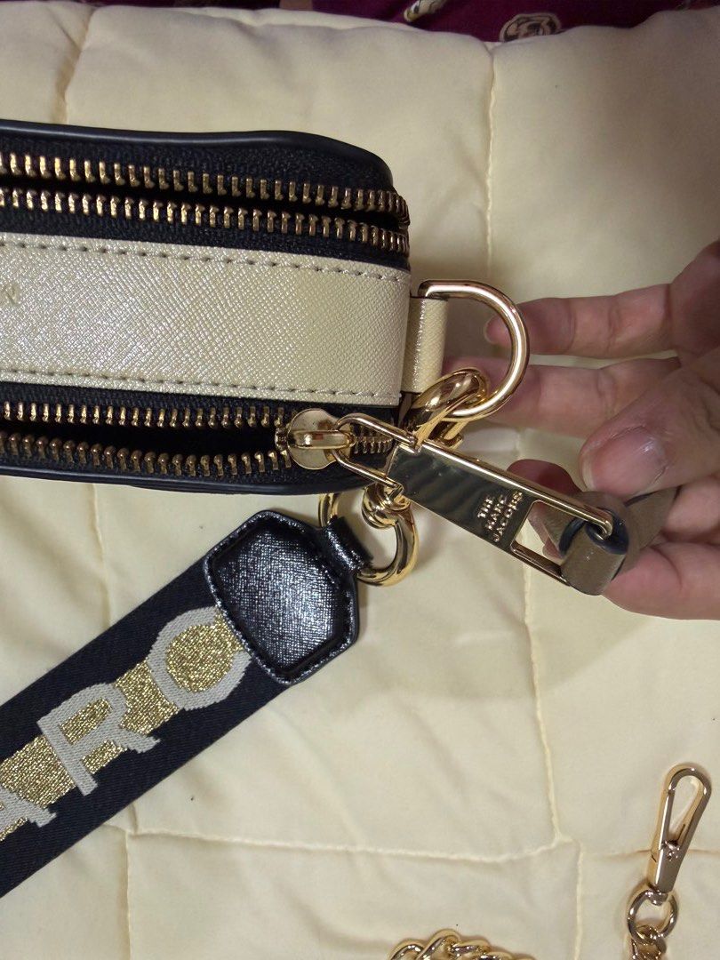 Marc Jacobs Snapshot Camera Bag with Straps and Pouch (Category: Luxury Bags & Wallets) located in Paranaque City. Submitted by kimgcham (Listing ID 1462373354, Image 3). Description: - Authentic Marc Jacobs Snapshot camera bag - Color: Taupe - Hardware: Gold - Includes original black dust bag - Comes with wide logo strap - Also includes a gold chain strap - Ideal for everyday use or travel.