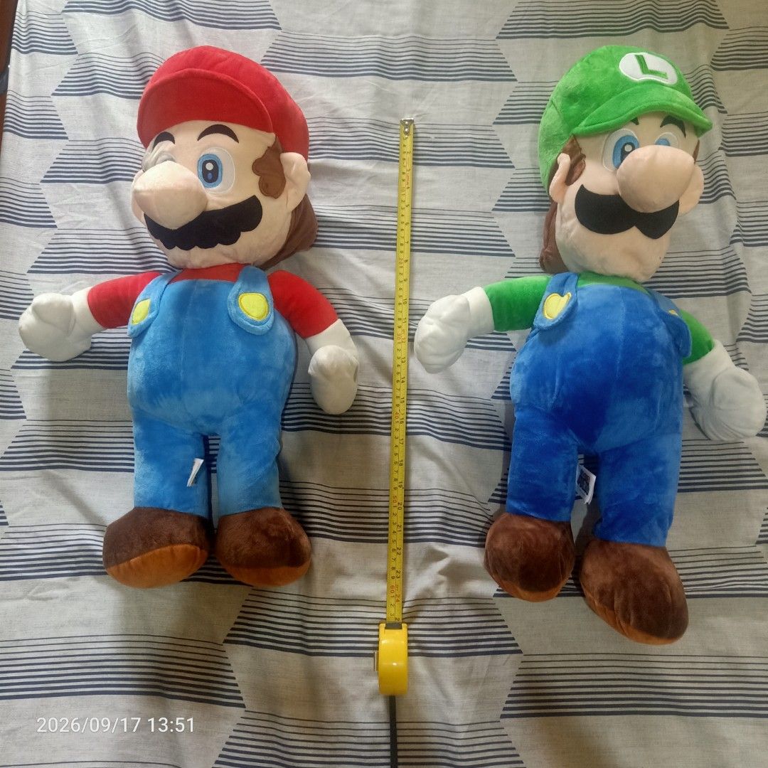 Mario and luigi etc. Plushie (Category: Plushies & Soft Toys) located in Manila. Submitted by yaaaaaj- (Listing ID 1462313582, Image 3). Description: Mario: Large plush wearing his classic red hat and blue overalls. Luigi: Large plush wearing a green hat and matching blue overalls. Yoshi: Large green and white dinosaur plush sitting at the front. Donkey Kong: Brown plush positioned on the upper shelf. Diddy Kong: Smaller brown plush with a red ca